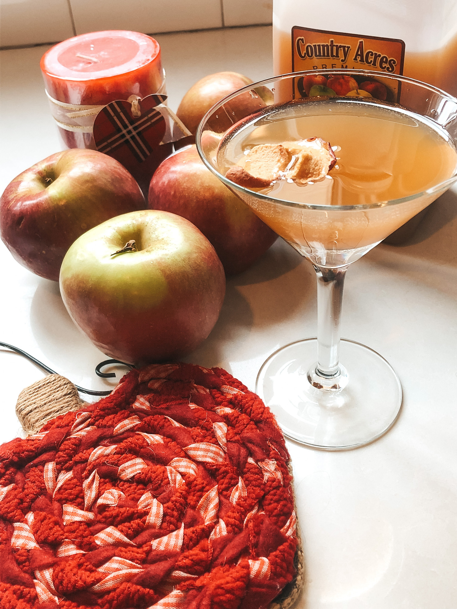 Apple cider mocktail and autumn decorations